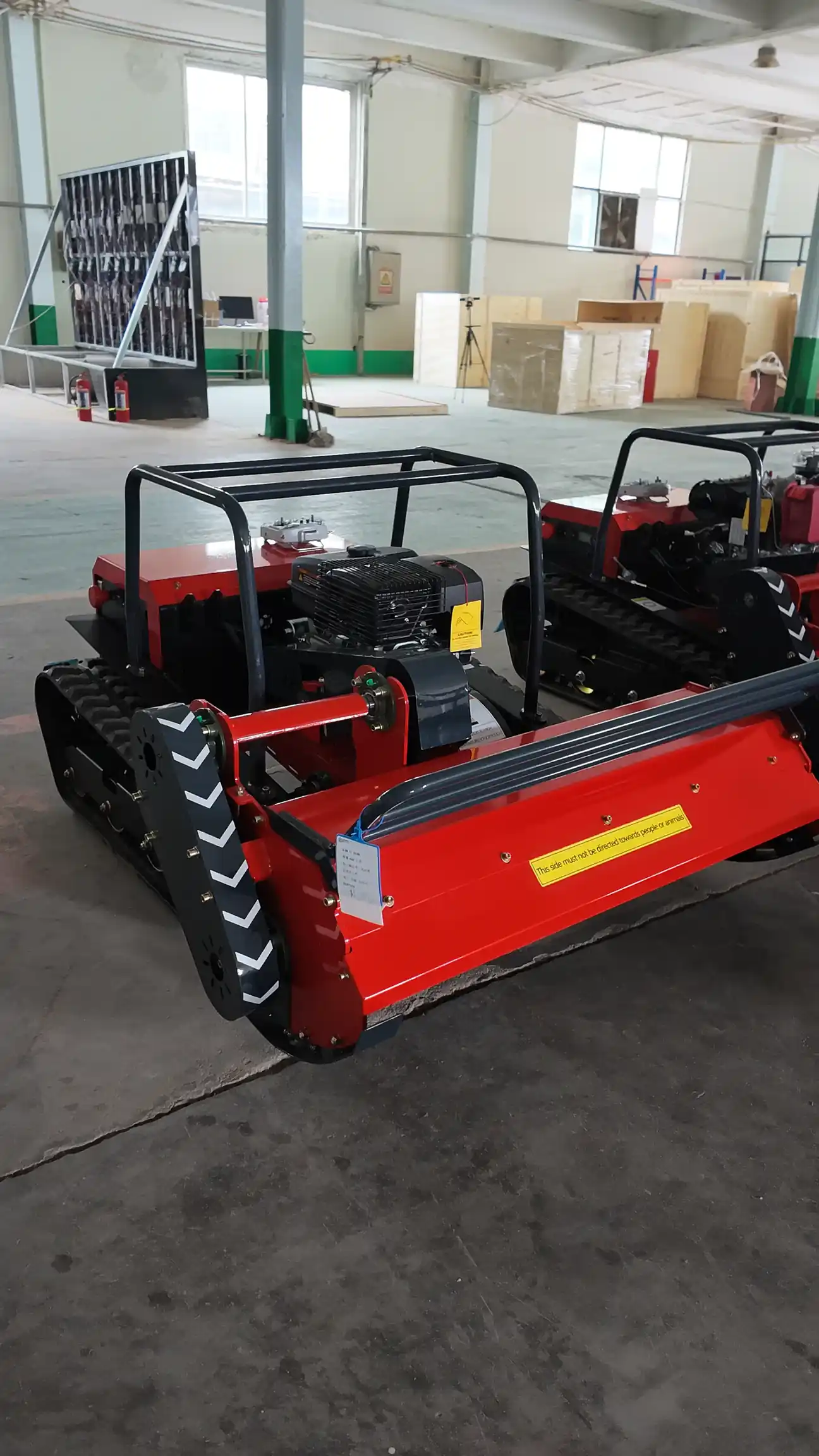 Remote control mowers displayed inside a production workshop