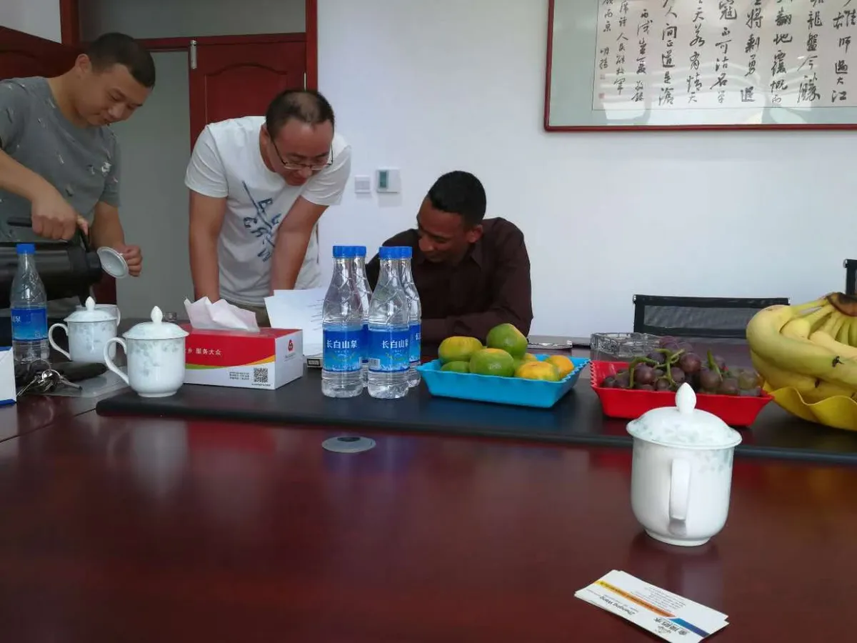 MERI representatives and a customer discussing project documents