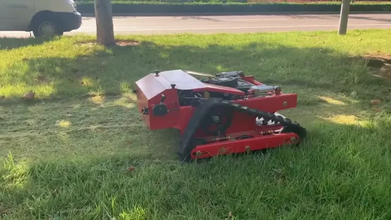 Tracked remote mower making a test cut through maintained grass
