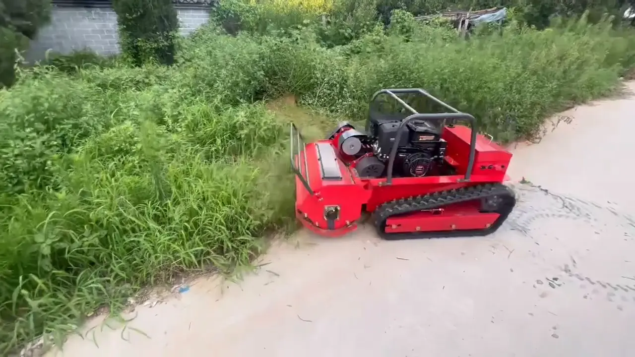 Tracked remote mower clearing vegetation beside a narrow paved path