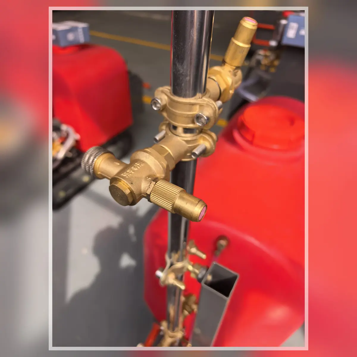 Boom sprayer nozzle detail on a MERI tracked sprayer