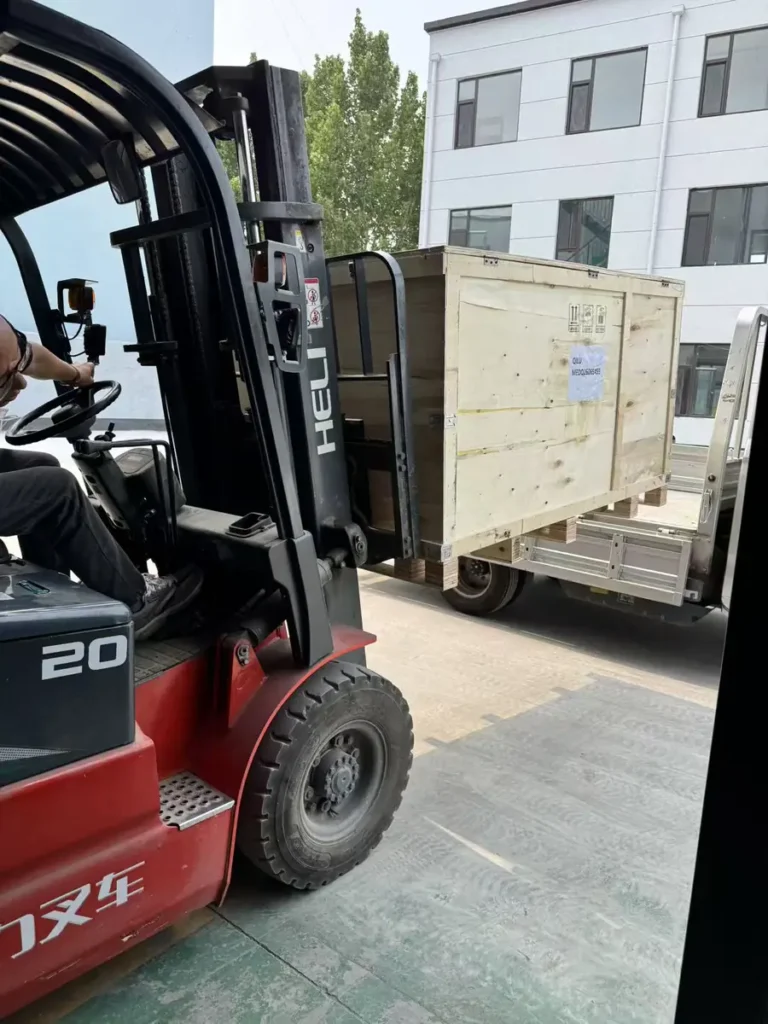 Forklift handling a wooden export crate for MERI equipment